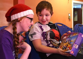 A child receiving a present