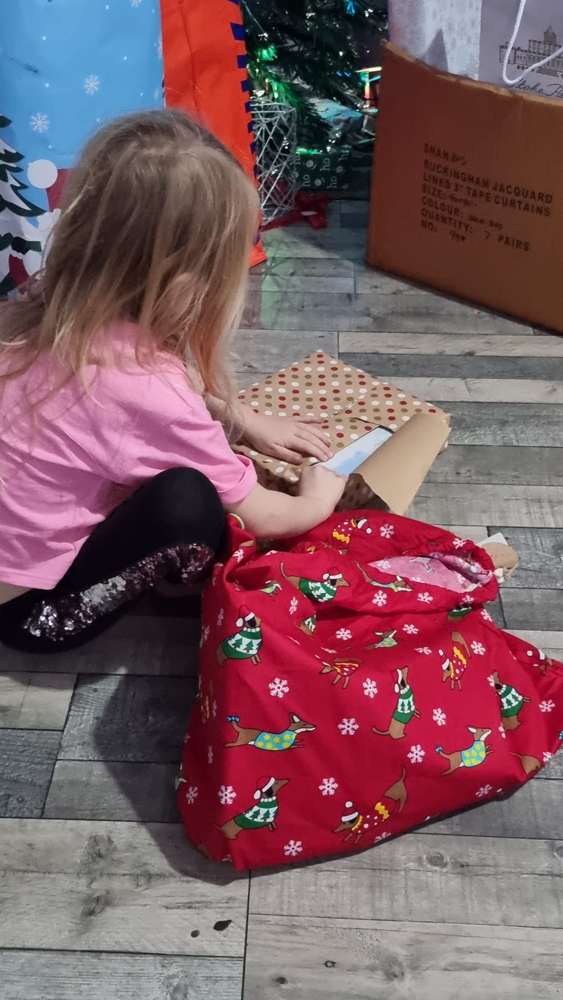 Child opening a wrapped gift